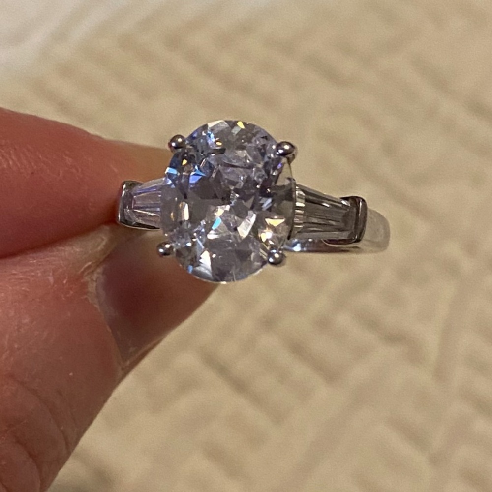 COPY - 8.92 carats oval and baguettes ring